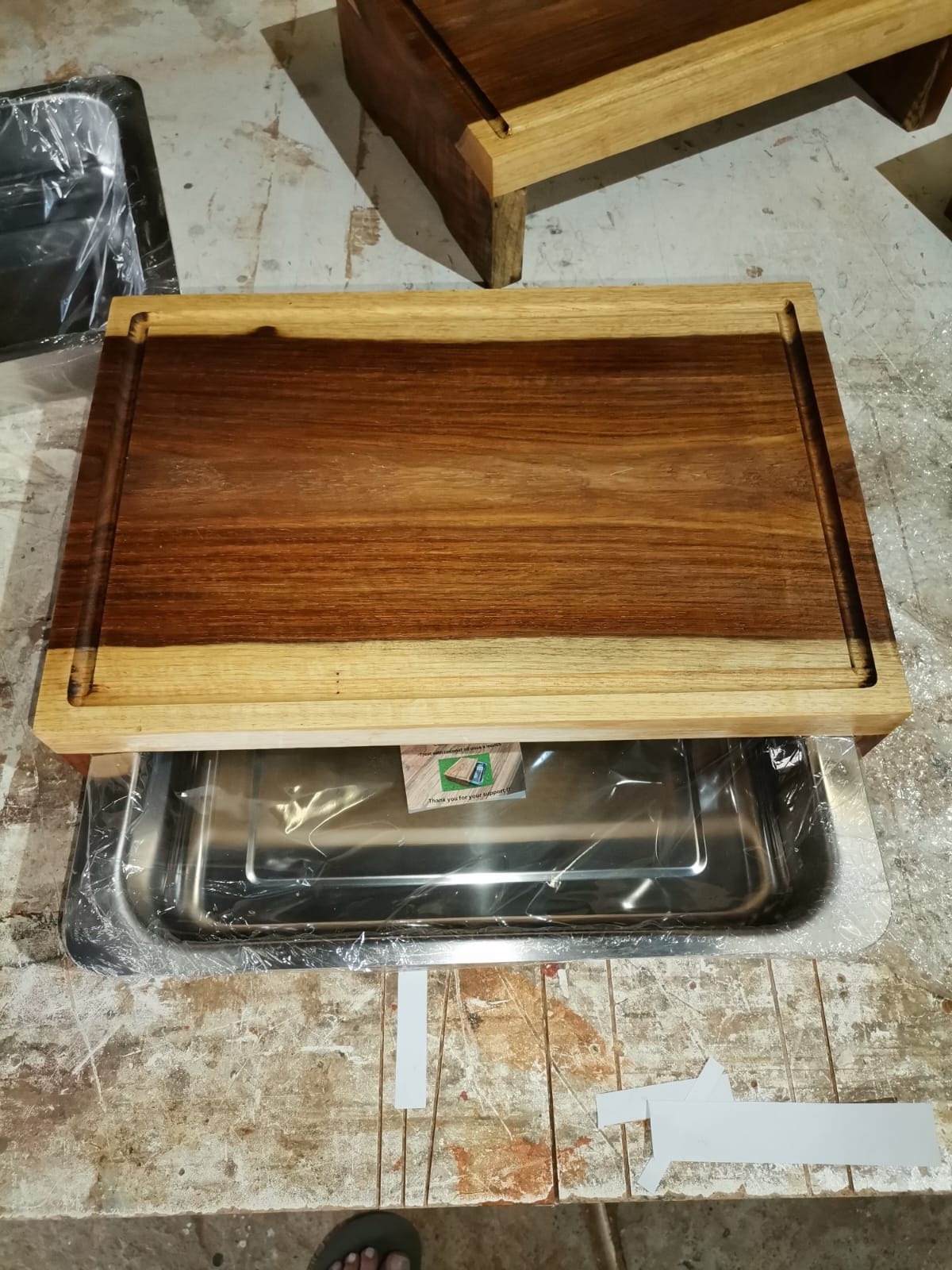 Workshop photo of a finished kiaat board with its tray extended